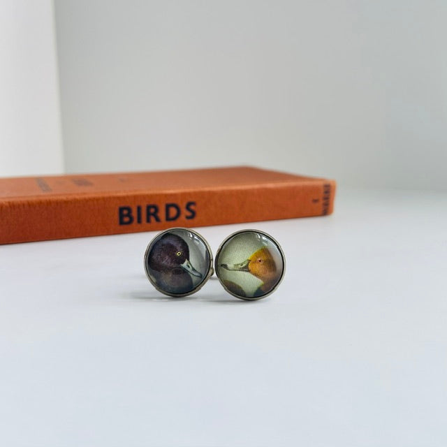 Bronze round cufflinks with an illustration of a duck, taken from a bird identification book