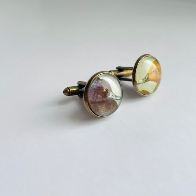 Bronze round cufflinks with an illustration of a duck, taken from a bird identification book