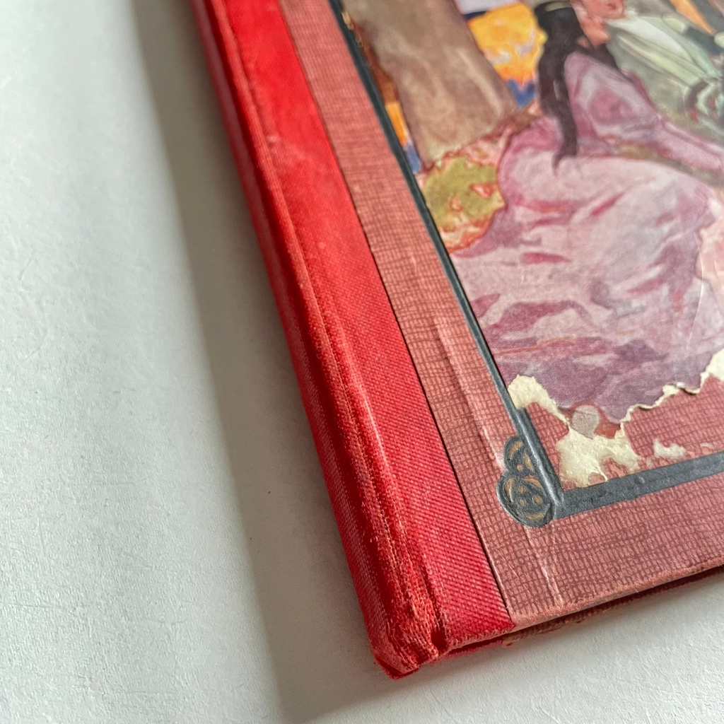 Vintage book with a colorful illustration on a white surface