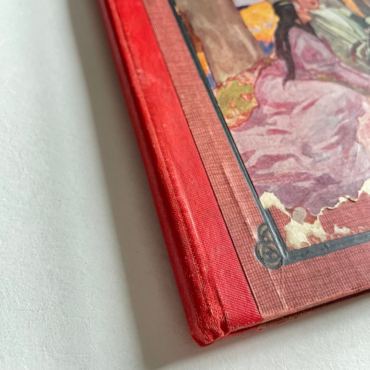 Vintage book with a colorful illustration on a white surface