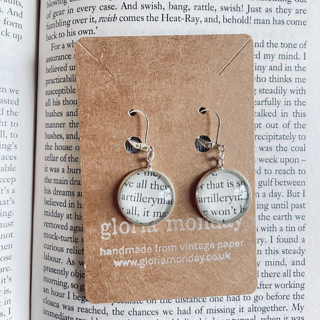 Silver round earring made from war of the worlds book pages featuring the artilleryman