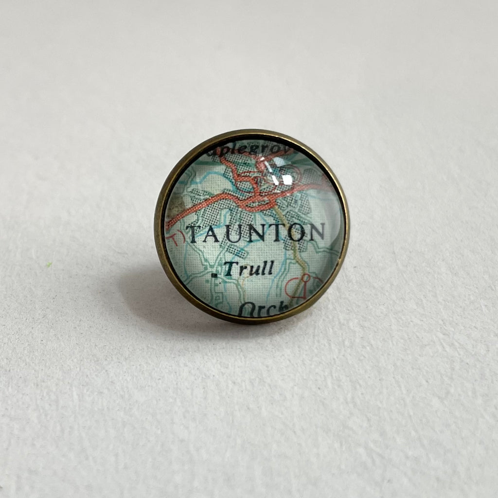 round minial bronze tie pin customised with a map of taunton uk