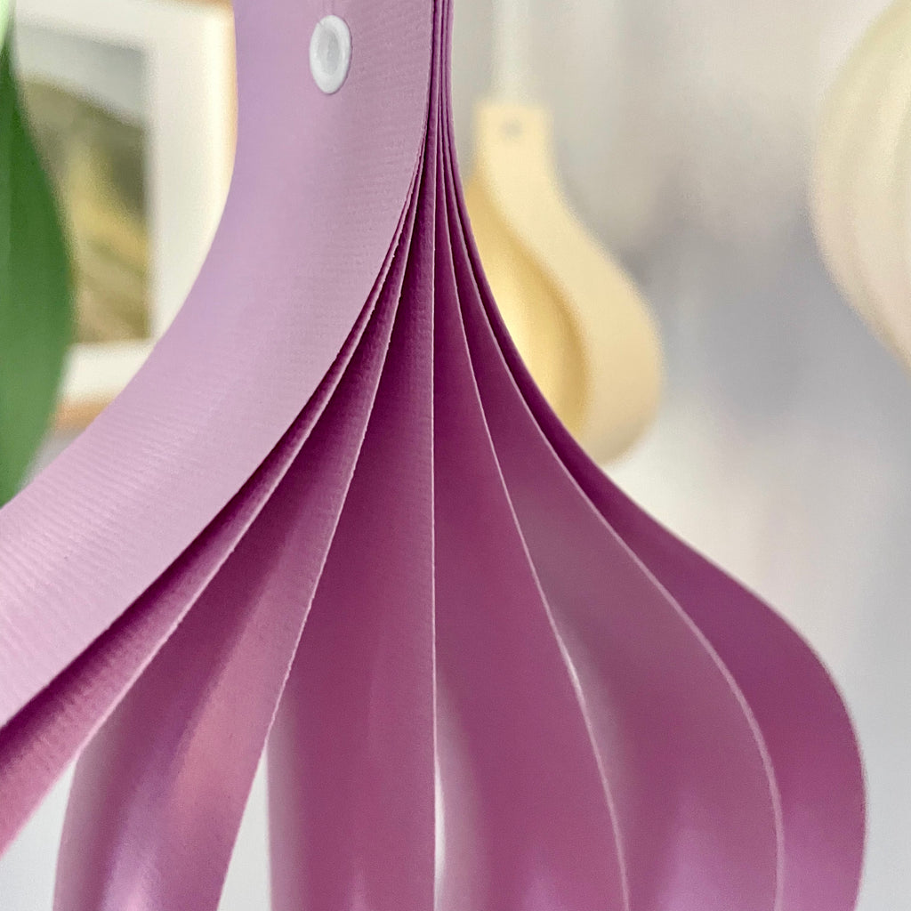 Close-up of a pastel purple large paper ornament 