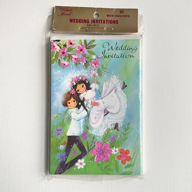 Pack of wedding invitations with a cartoon design of a couple in a garden setting.