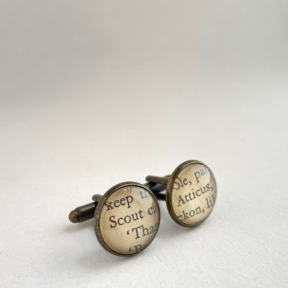 Cufflinks with text on a white background