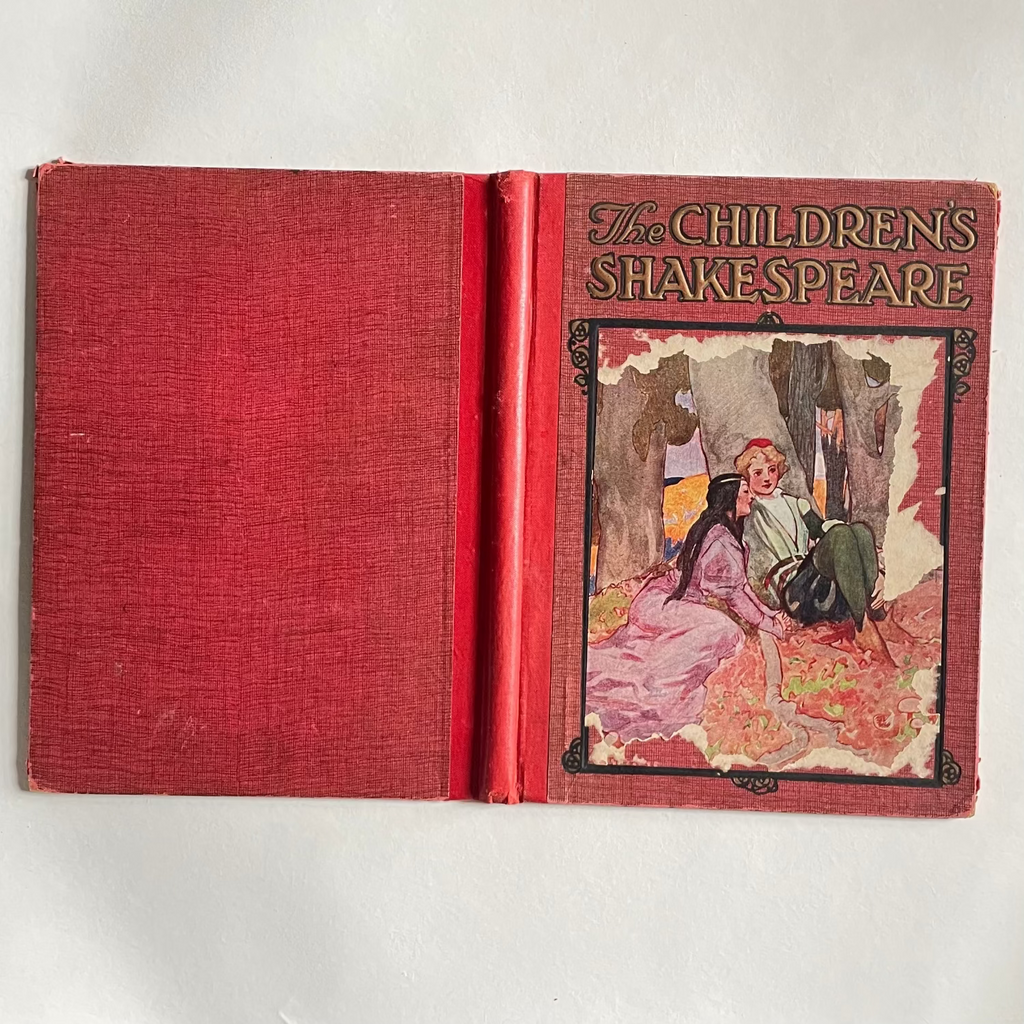 Vintage book titled 'The Children's Shakespeare' with a red cover and illustrated frontispiece on a white background.