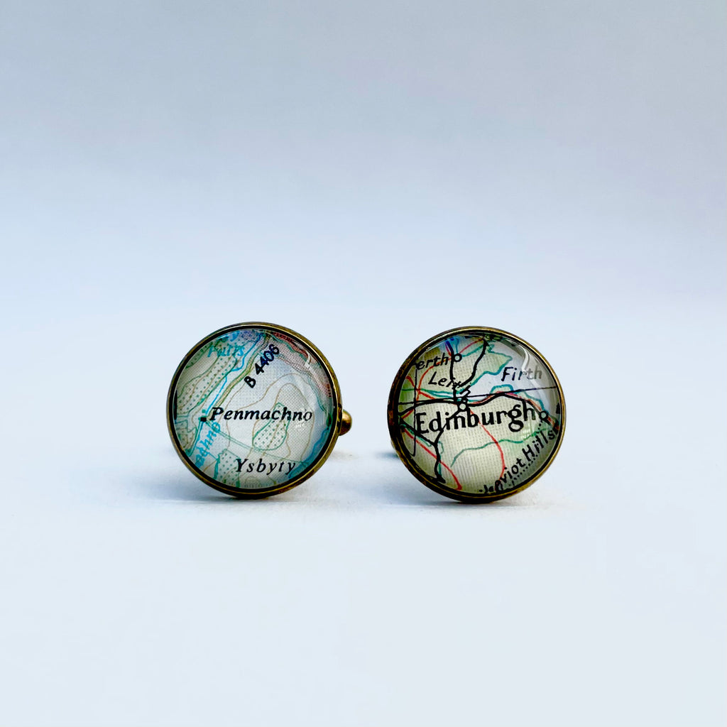 a set of bronze round cufflinks with Edinburgh scotland also penmacho wales