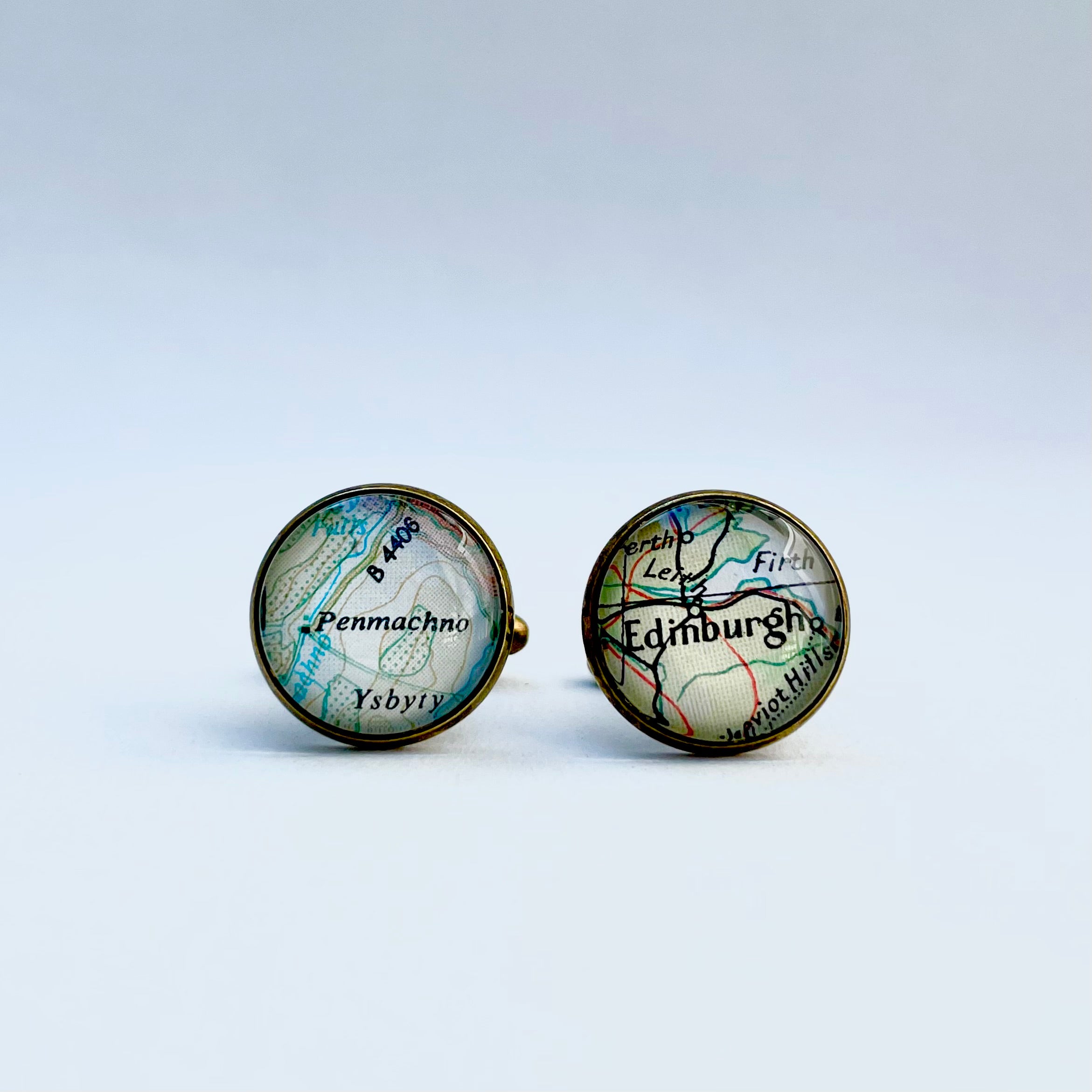 a set of bronze round cufflinks with Edinburgh scotland also penmacho wales